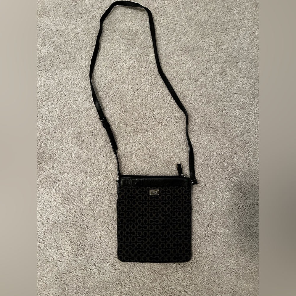 Black COACH crossbody purse.